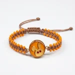 دستبند گرد بچگانه نارنجي باني خرگوش بچه‌گانه با پلاک استیل ضد حساسیت و طرح ورق طلای ۲۴ عیار دانژه